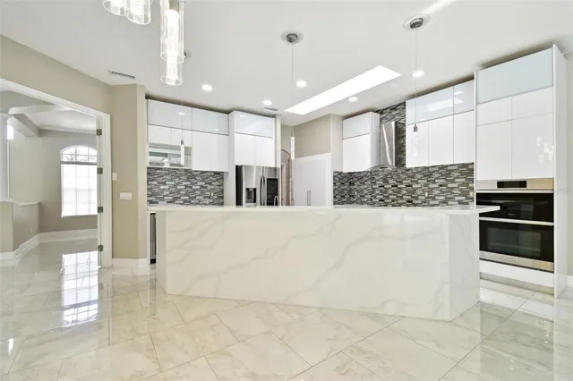 a kitchen with cabinets and white appliances