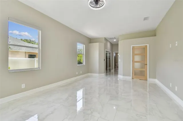 a view of a kitchen with a refrigerator and a sink