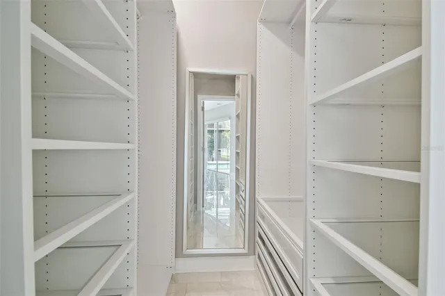 an empty room with windows and entrance