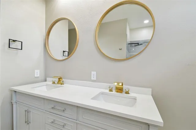 a bathroom with a sink and mirror