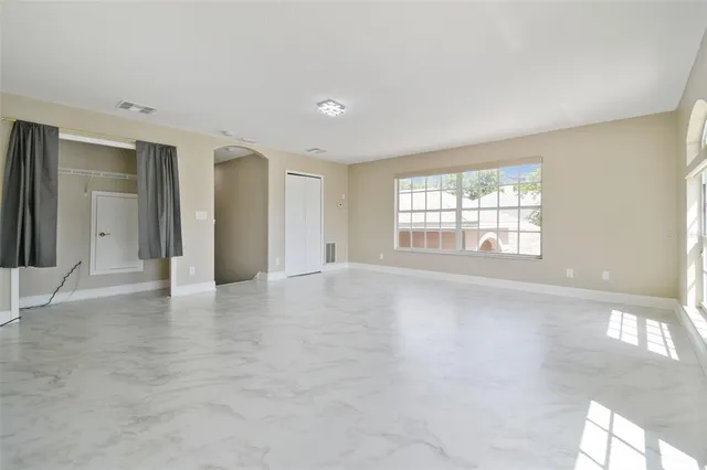a view of a backyard with a garden and porch