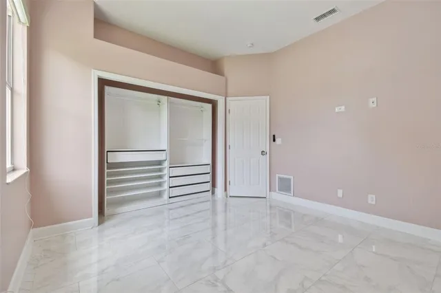 a bathroom with a bathtub and trees