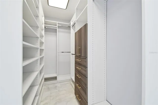 an aerial view of residential houses with outdoor space and swimming pool