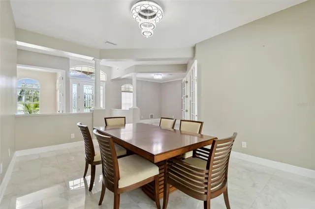 a view of kitchen with livingroom and natural light