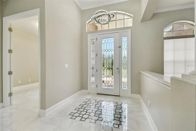 a view of kitchen with stainless steel appliances kitchen island granite countertop a stove a sink and a refrigerator