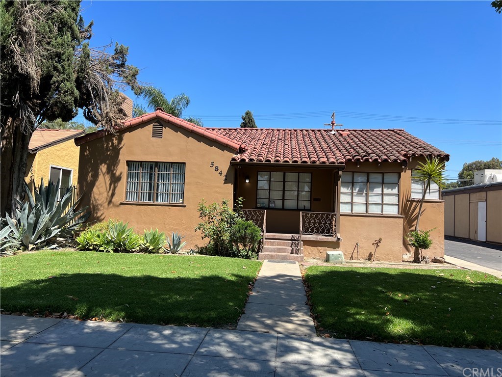 5842 Magnolia Avenue Riverside, CA 92506 - Photo 1 of 1 a front view of a house with a yard