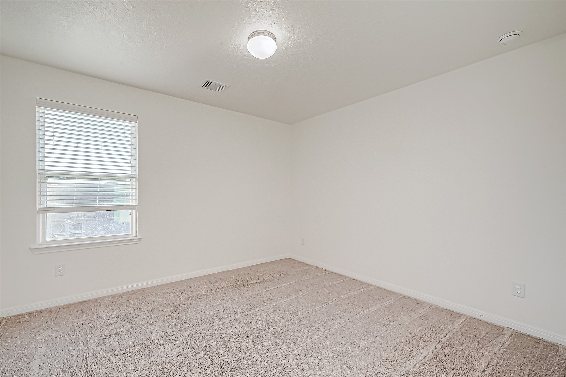 7106 Escondido Drive Rosharon, TX 77583 - Photo 26 of 41 an empty room with a window