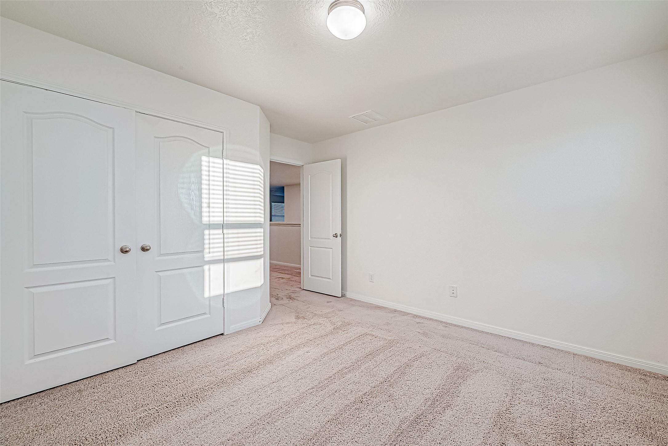 7106 Escondido Drive Rosharon, TX 77583 - Photo 27 of 41 a view of empty room with wooden floor and window