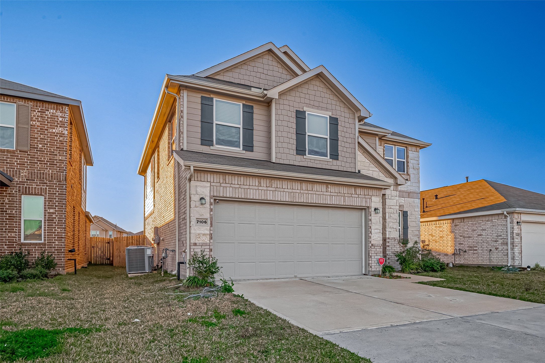 7106 Escondido Drive Rosharon, TX 77583 - Photo 41 of 41 a front view of a house with a yard and garage