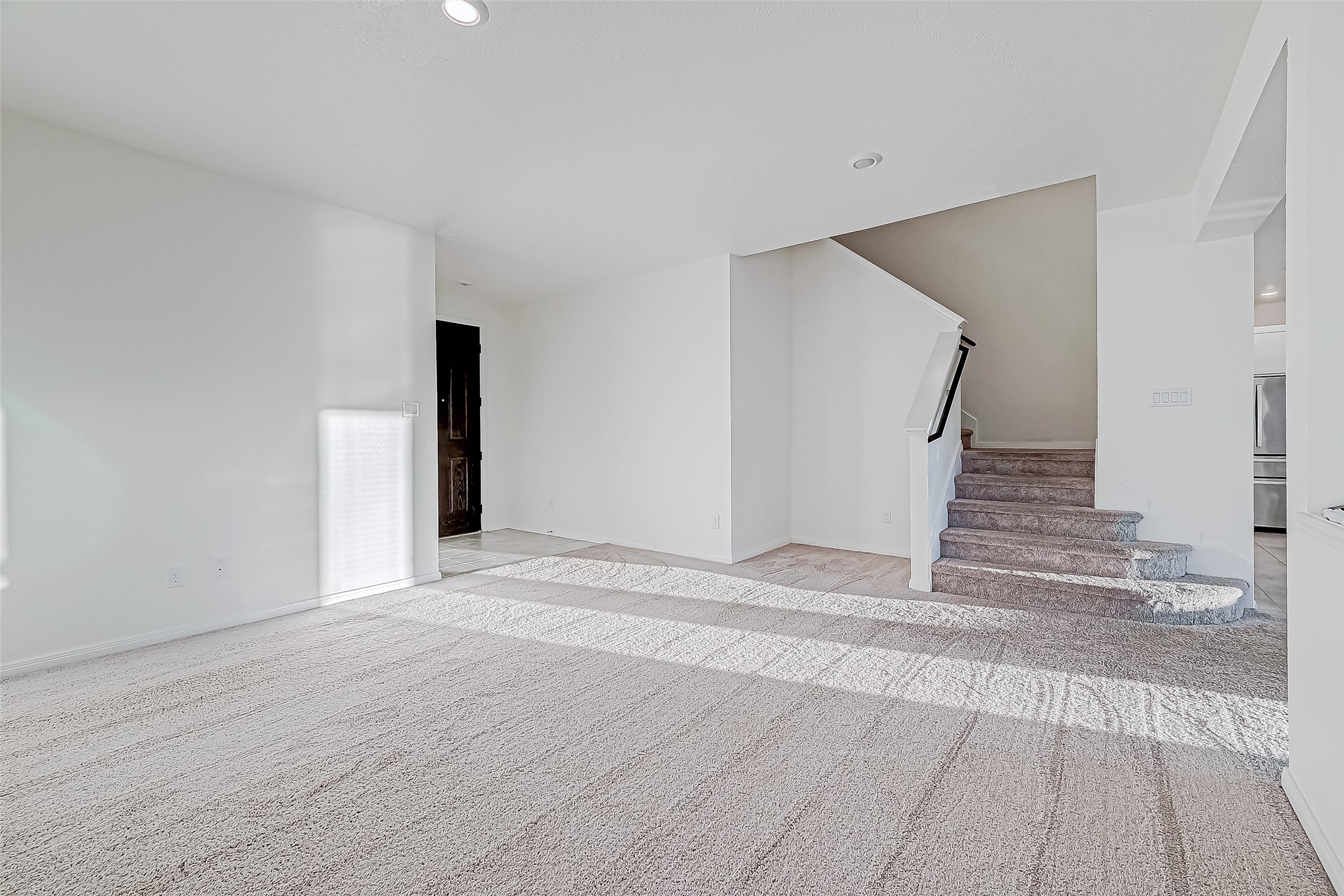 7106 Escondido Drive Rosharon, TX 77583 - Photo 5 of 41 a view of a livingroom with wooden floor and staircase