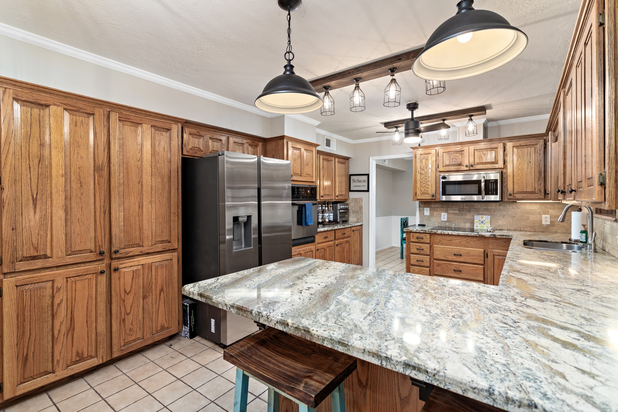 1747 Farm To Market Road 365 Nome, TX 77629 - Photo 9 of 24 a kitchen with stainless steel appliances granite countertop a refrigerator a oven a sink and dishwasher