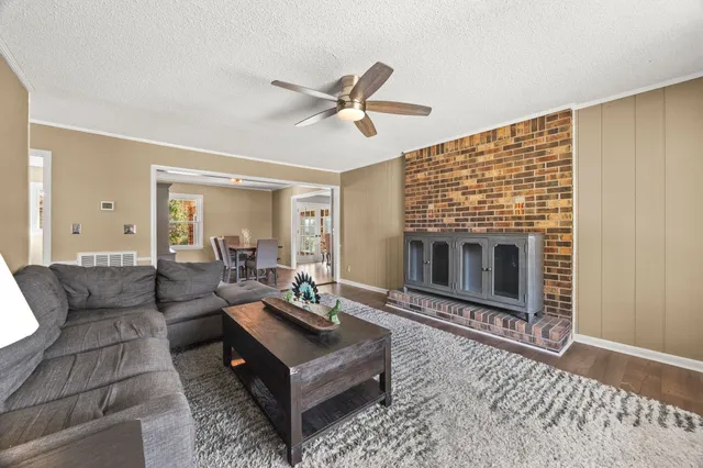 a living room with furniture windows and a fireplace