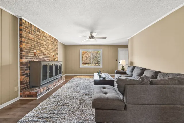 a view of a dining room with furniture and window