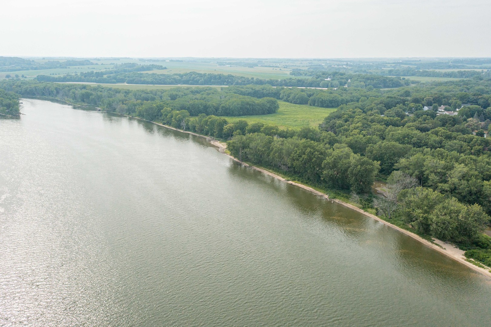 0 River Drive Byron, IL 61010 - Photo 19 of 33 a view of a river and a yard in back