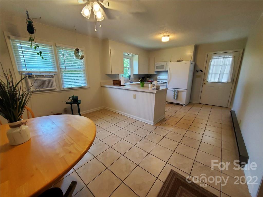 4681 Emerald Drive Morganton, NC 28655 - Photo 14 of 38 a kitchen with a sink cabinets and window