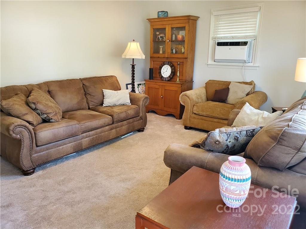 4681 Emerald Drive Morganton, NC 28655 - Photo 17 of 38 a living room with furniture and a couch