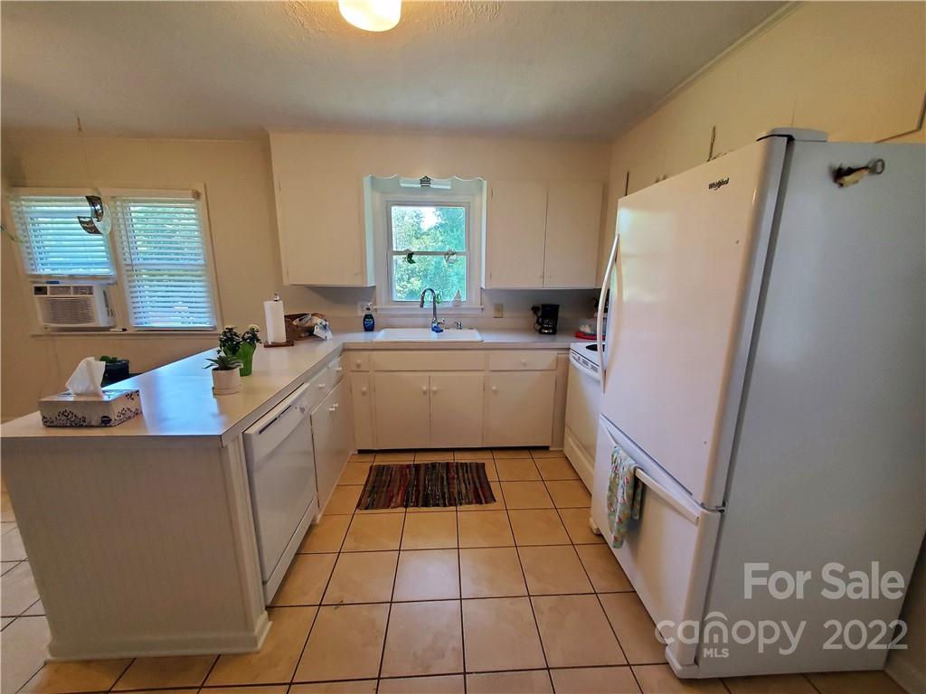 4681 Emerald Drive Morganton, NC 28655 - Photo 8 of 38 a utility room with a sink a washer and dryer