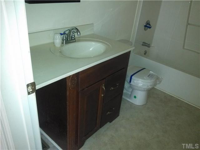351 Holt Road Graham, NC 27253 - Photo 9 of 14 2 of 2 full baths, located in the family room which can really serve as a master bedroom (includes full bath and wic) located at the rear of house.
