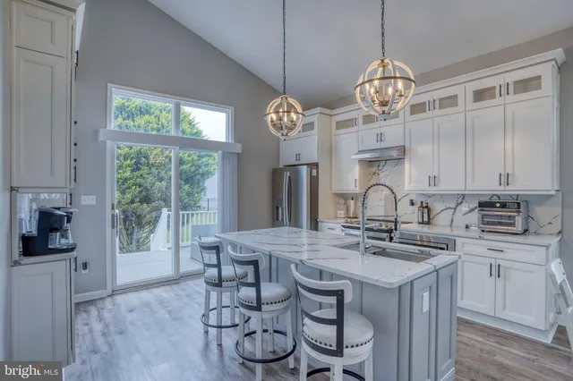 a bedroom with a bed tv and a window