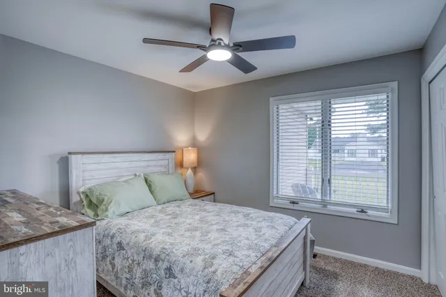 an aerial view of a residential houses with outdoor space