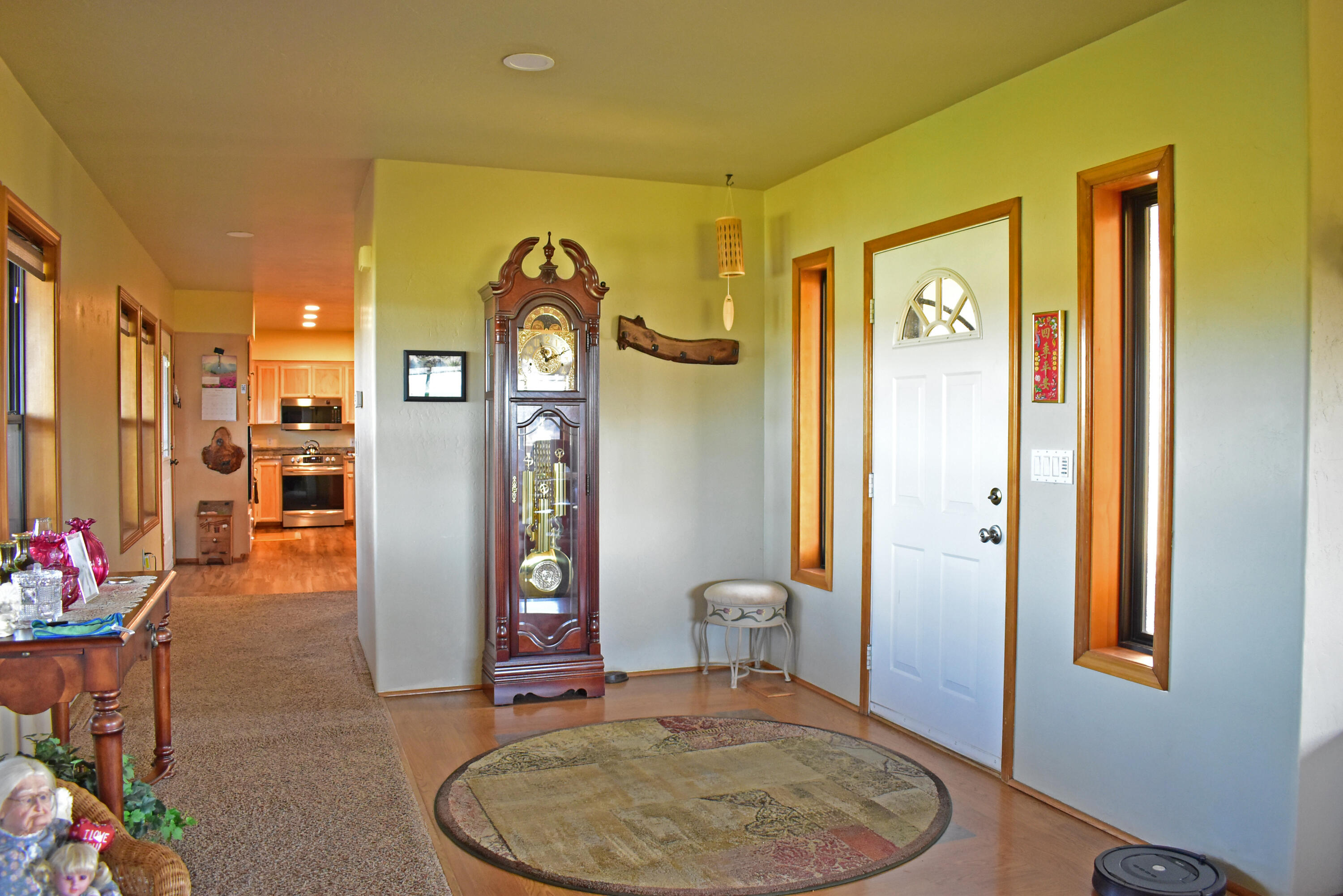 865 Reese Creek Road Eagle Point, OR 97524 - Photo 15 of 37 a view of a hallway to a livingroom with furniture