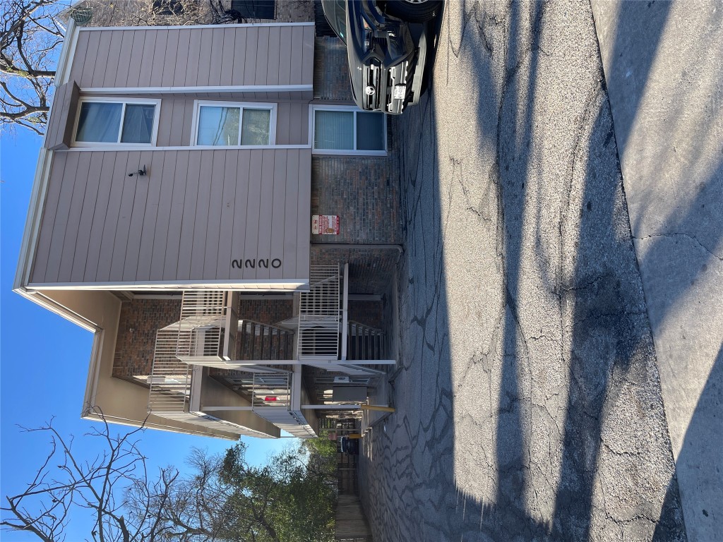 a front view of a house with parking space