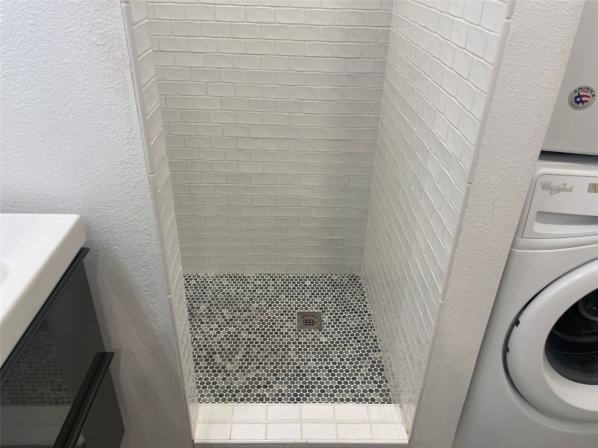 2220 Leon Street, Unit 103 Austin, TX 78705 - Photo 13 of 15 a bathroom with a sink and a toilet