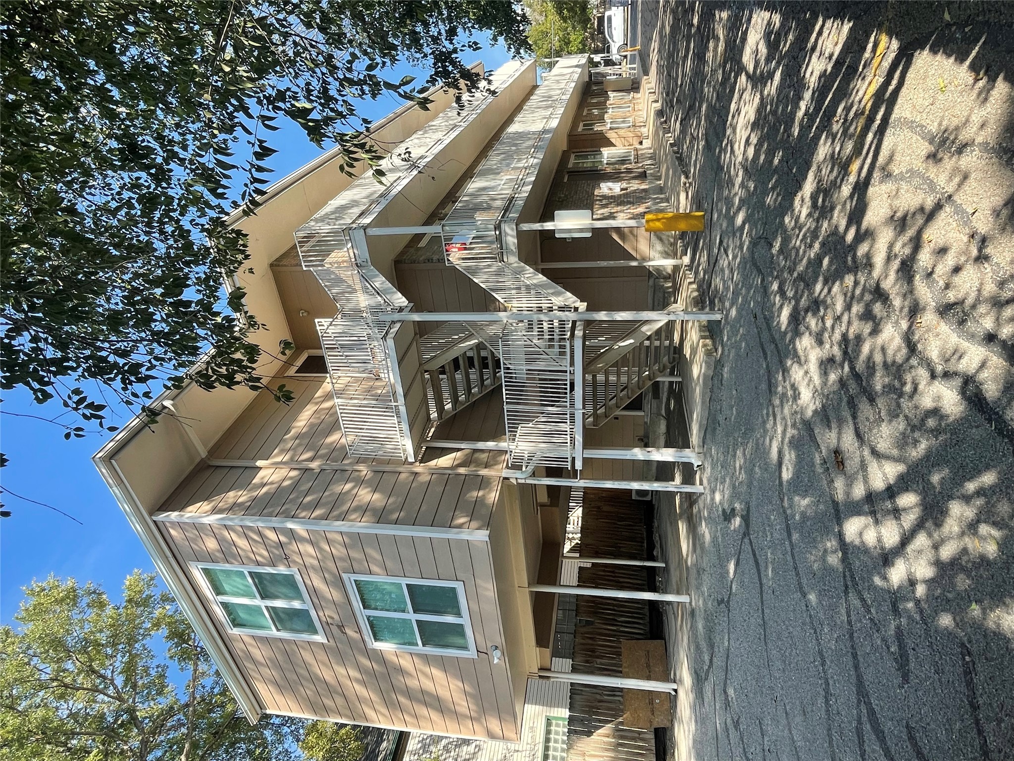 2220 Leon Street, Unit 103 Austin, TX 78705 - Photo 2 of 15 a front view of a house with large trees