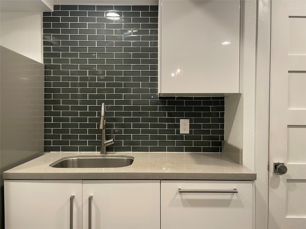 2220 Leon Street, Unit 103 Austin, TX 78705 - Photo 8 of 15 a bathroom with a sink a vanity and a shower