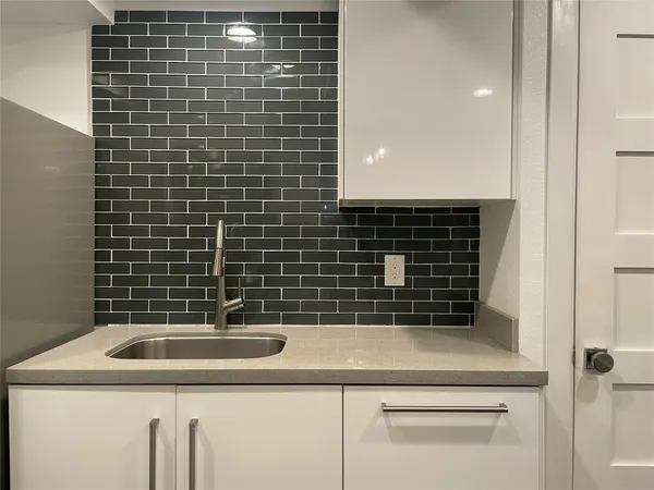 a bathroom with a sink a vanity and a shower