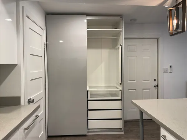 a view of walk in closet with window