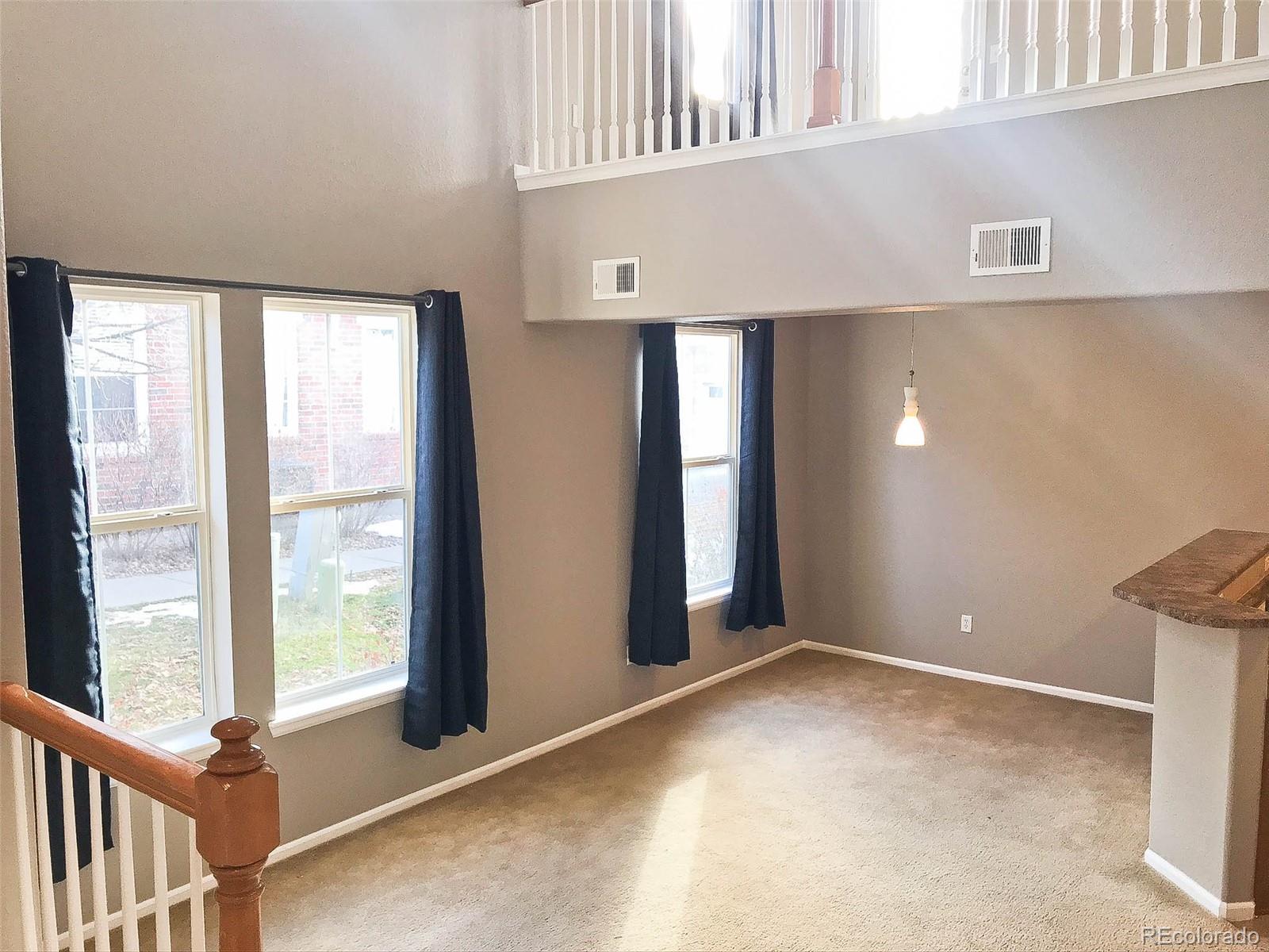 6753 South Winnipeg Circle, Unit 101 Aurora, CO 80016 - Photo 12 of 36 a view of an empty room with a window