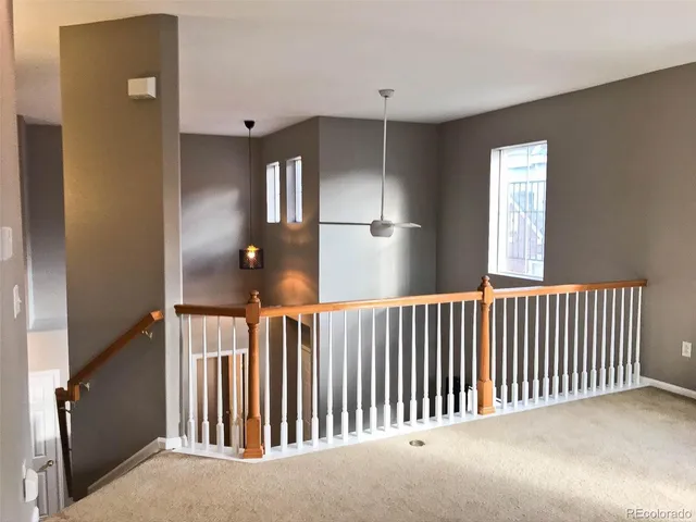 a view of a hallway with windows