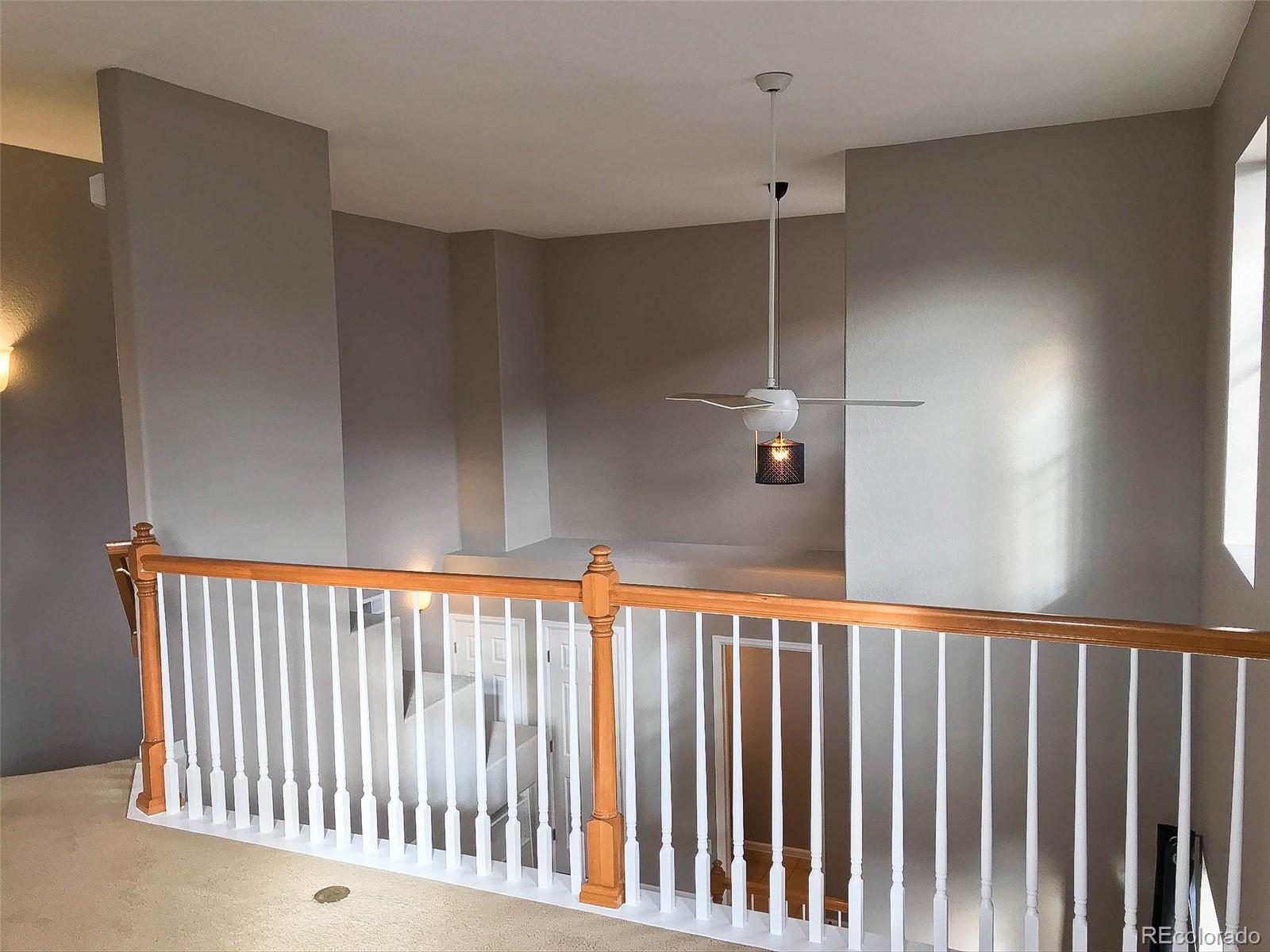 6753 South Winnipeg Circle, Unit 101 Aurora, CO 80016 - Photo 18 of 36 a view of a hallway