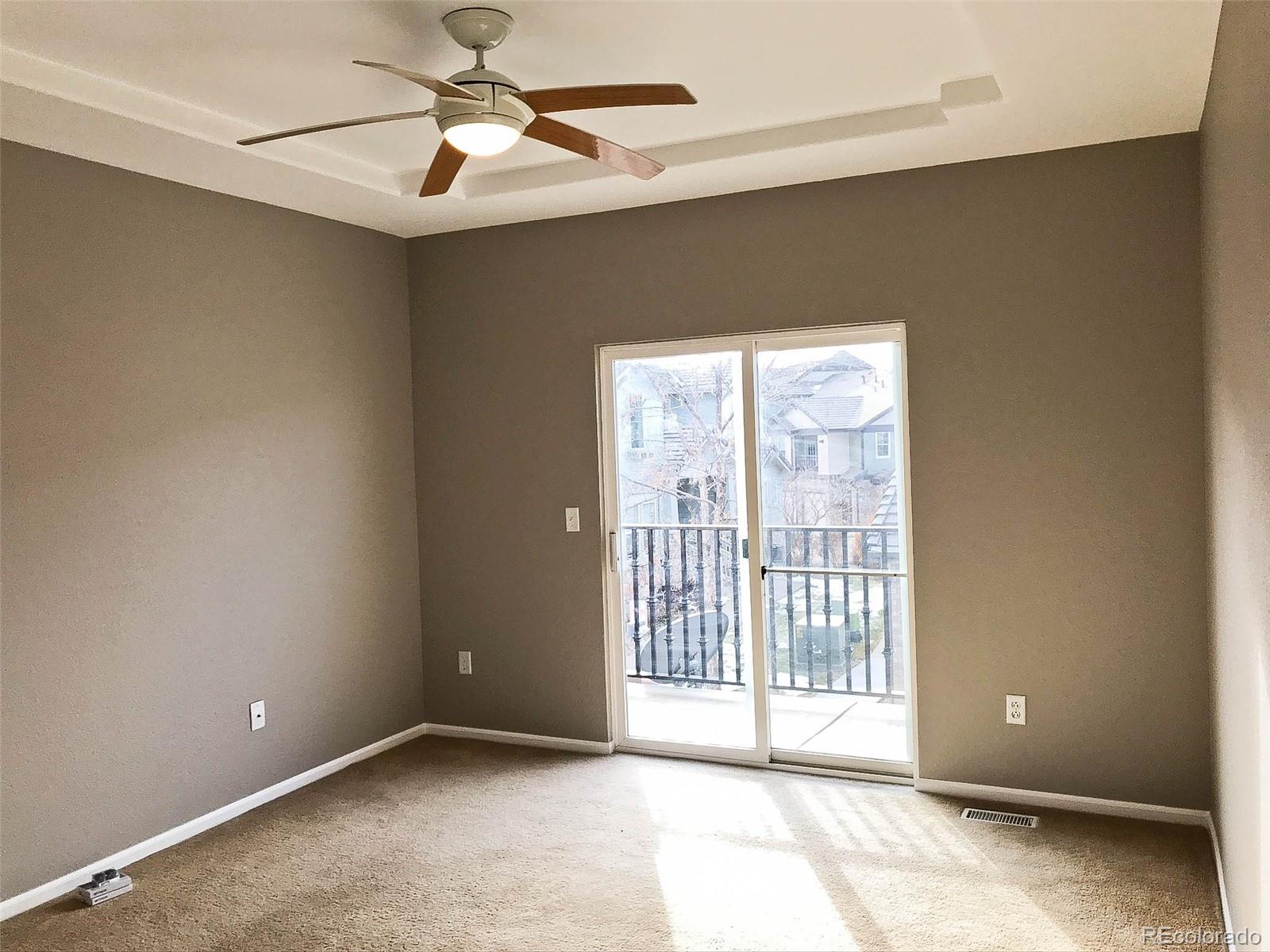 6753 South Winnipeg Circle, Unit 101 Aurora, CO 80016 - Photo 22 of 36 a view of an empty room with a window