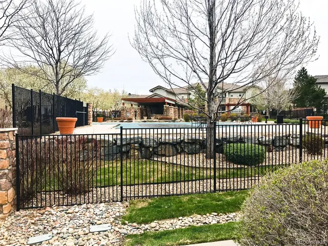 a childrens park with lots of trees and plants