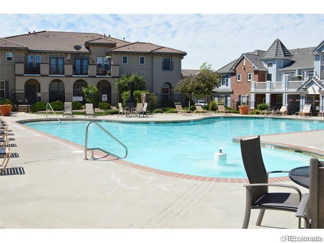 6753 South Winnipeg Circle, Unit 101 Aurora, CO 80016 - Photo 35 of 36 a front view of house with yard and outdoor seating