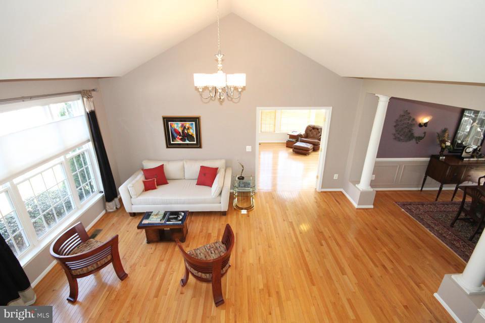 6253 Rolling Spring Court Springfield, VA 22152 - Photo 3 of 30 a living room with furniture and a flat screen tv