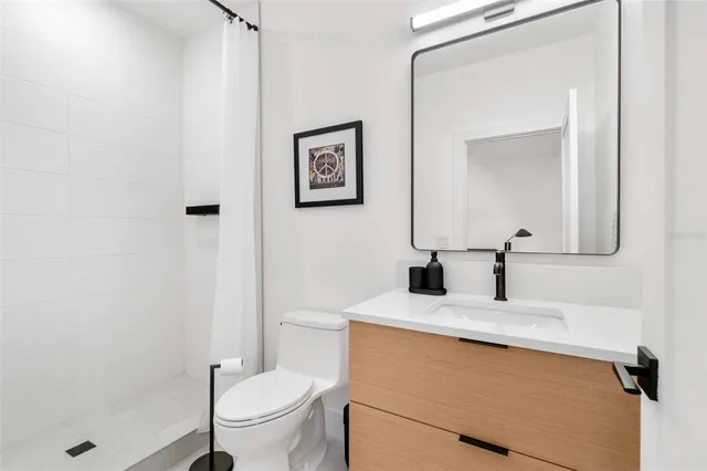 a white bench sitting in front of a building