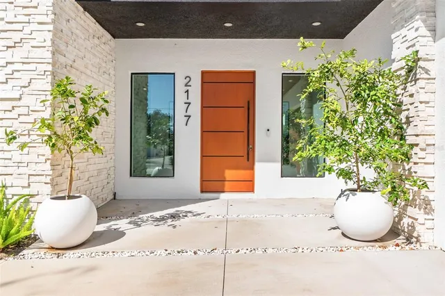 a kitchen with kitchen island a stove a table and chairs