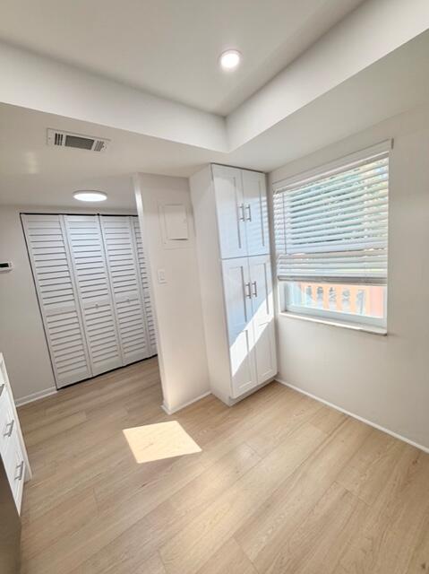 9374 Southwest 3rd Street, Unit 714 Boca Raton, FL 33428 - Photo 4 of 21 a view of empty room with wooden floor and fan