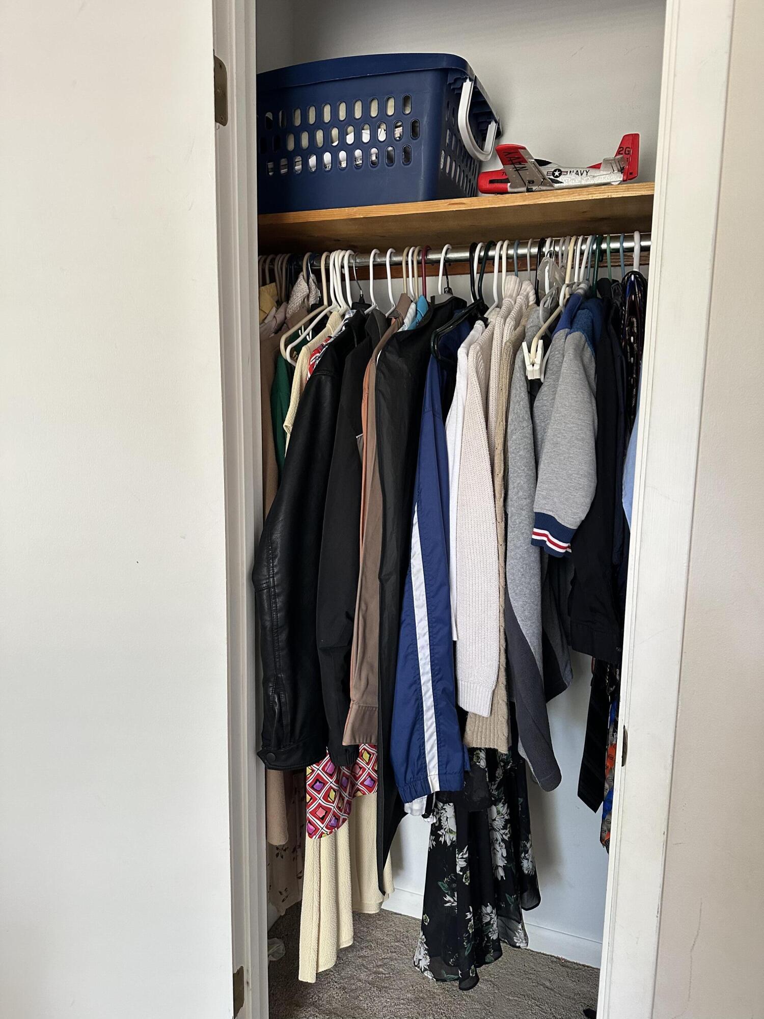 4872 Griffith Mill Road Holt, FL 32564 - Photo 11 of 15 a view of walk in closet with clothes and shoes