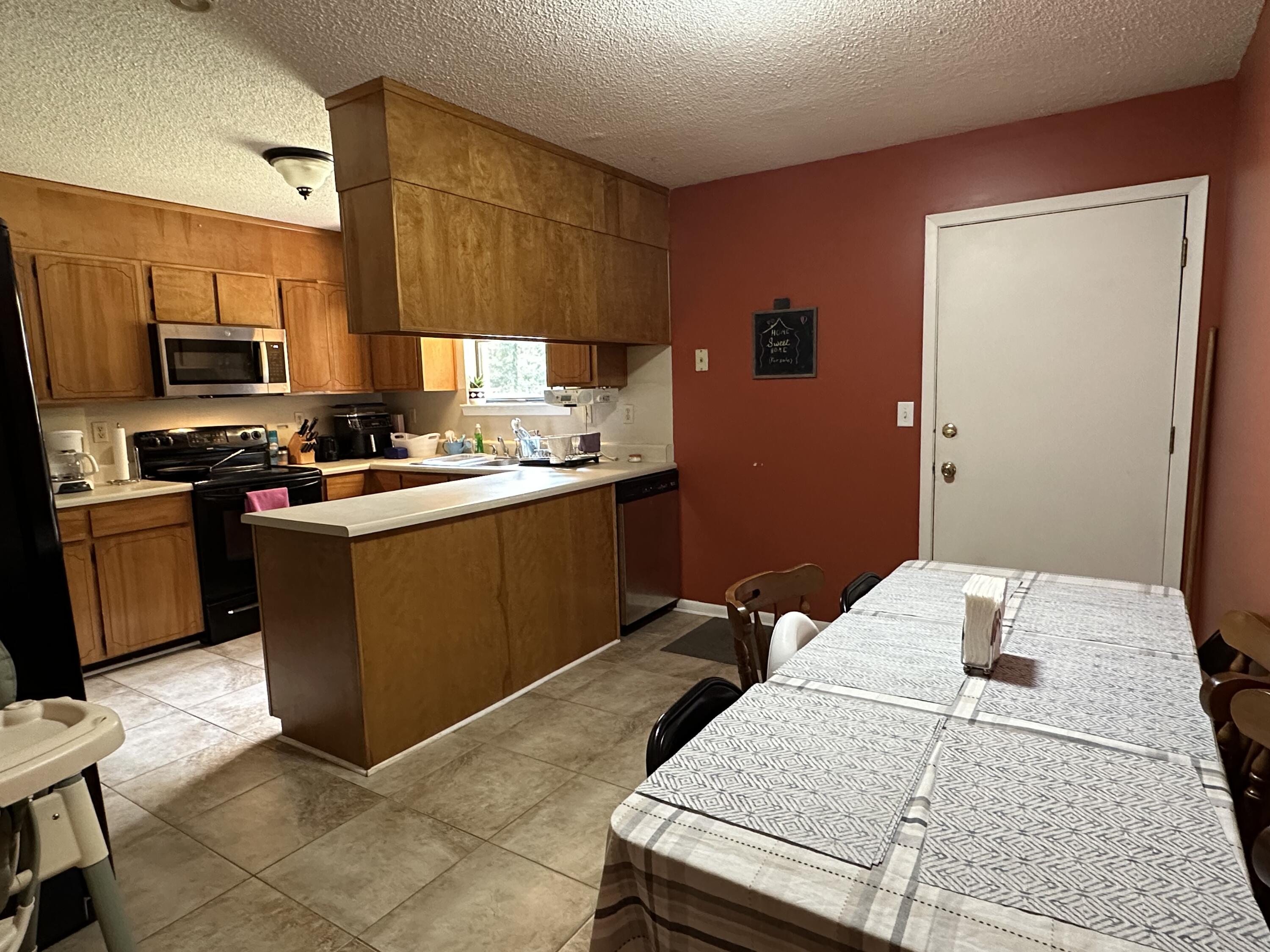 4872 Griffith Mill Road Holt, FL 32564 - Photo 3 of 15 a kitchen with a sink appliances and cabinets