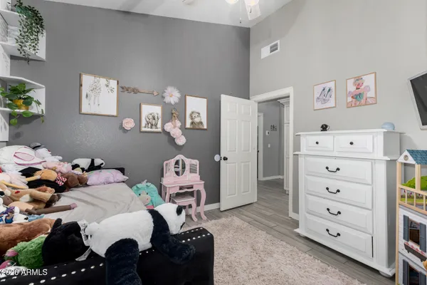 an aerial view of residential houses with outdoor space and swimming pool