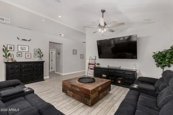 a kitchen with stainless steel appliances a stove center island refrigerator and cabinets
