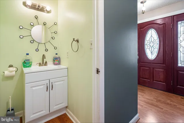 a view of a hallway with a bathroom