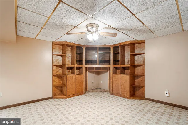 a view of a hallway with a refrigerator