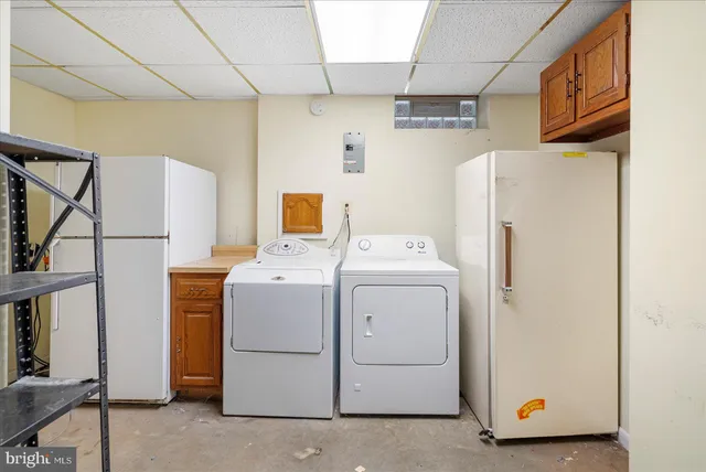 a kitchen with stainless steel appliances granite countertop a refrigerator and cabinets