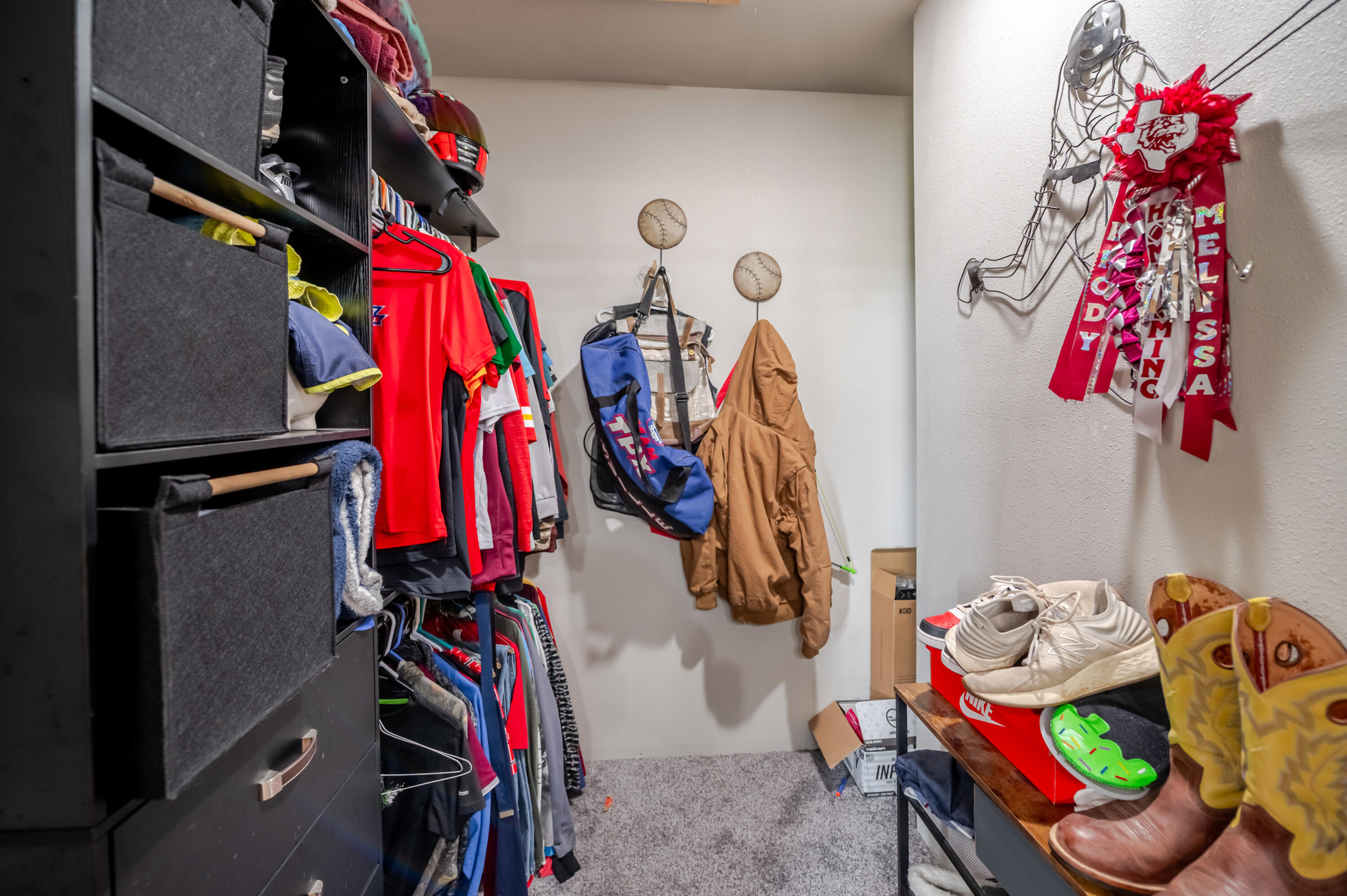 6792 Maine Road Anton, TX 79313 - Photo 47 of 77 a view of walk in closet with clothes and shoes