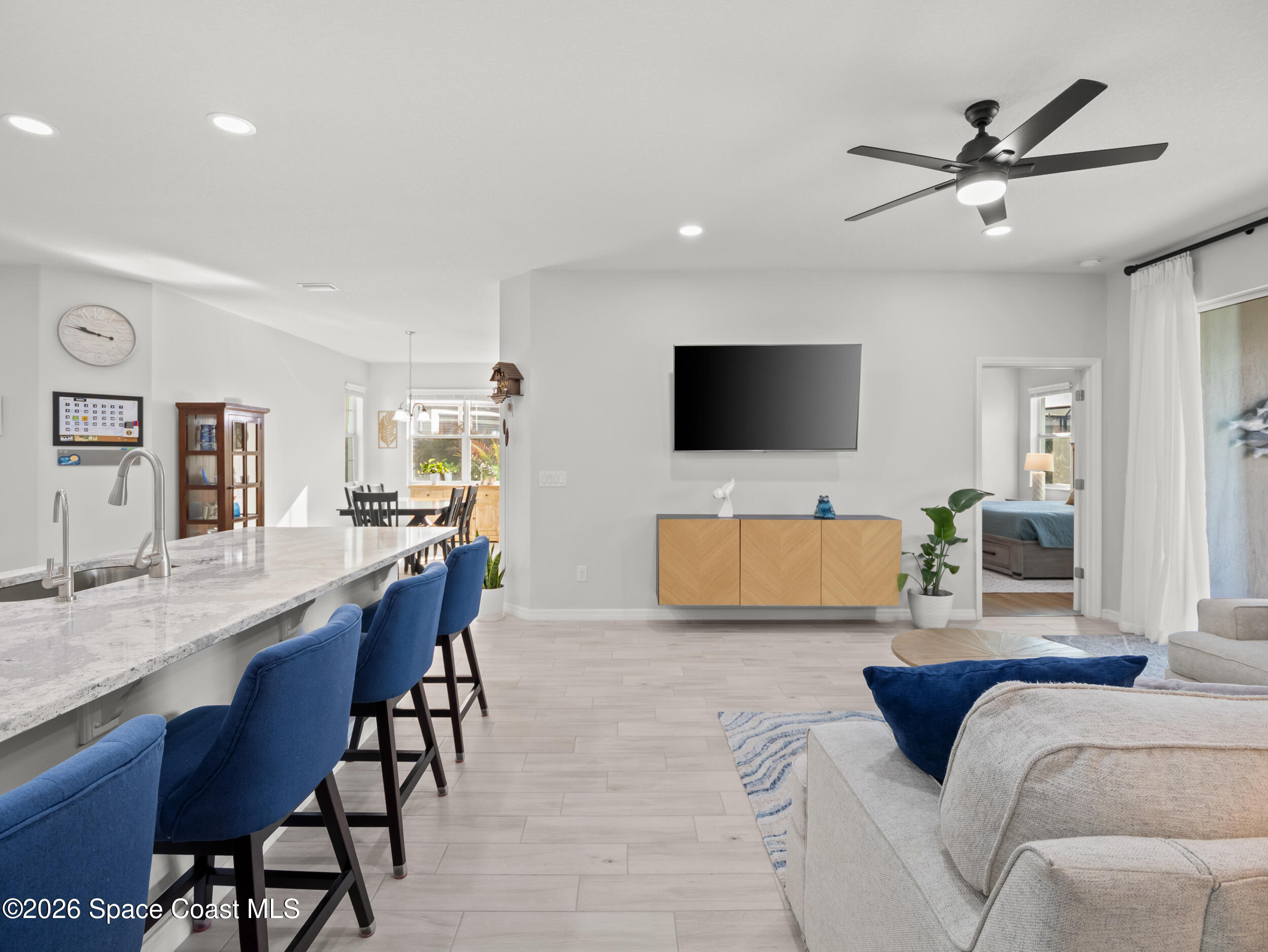 3363 Addison Drive Melbourne, FL 32940 - Photo 11 of 53 a living room with furniture and a flat screen tv